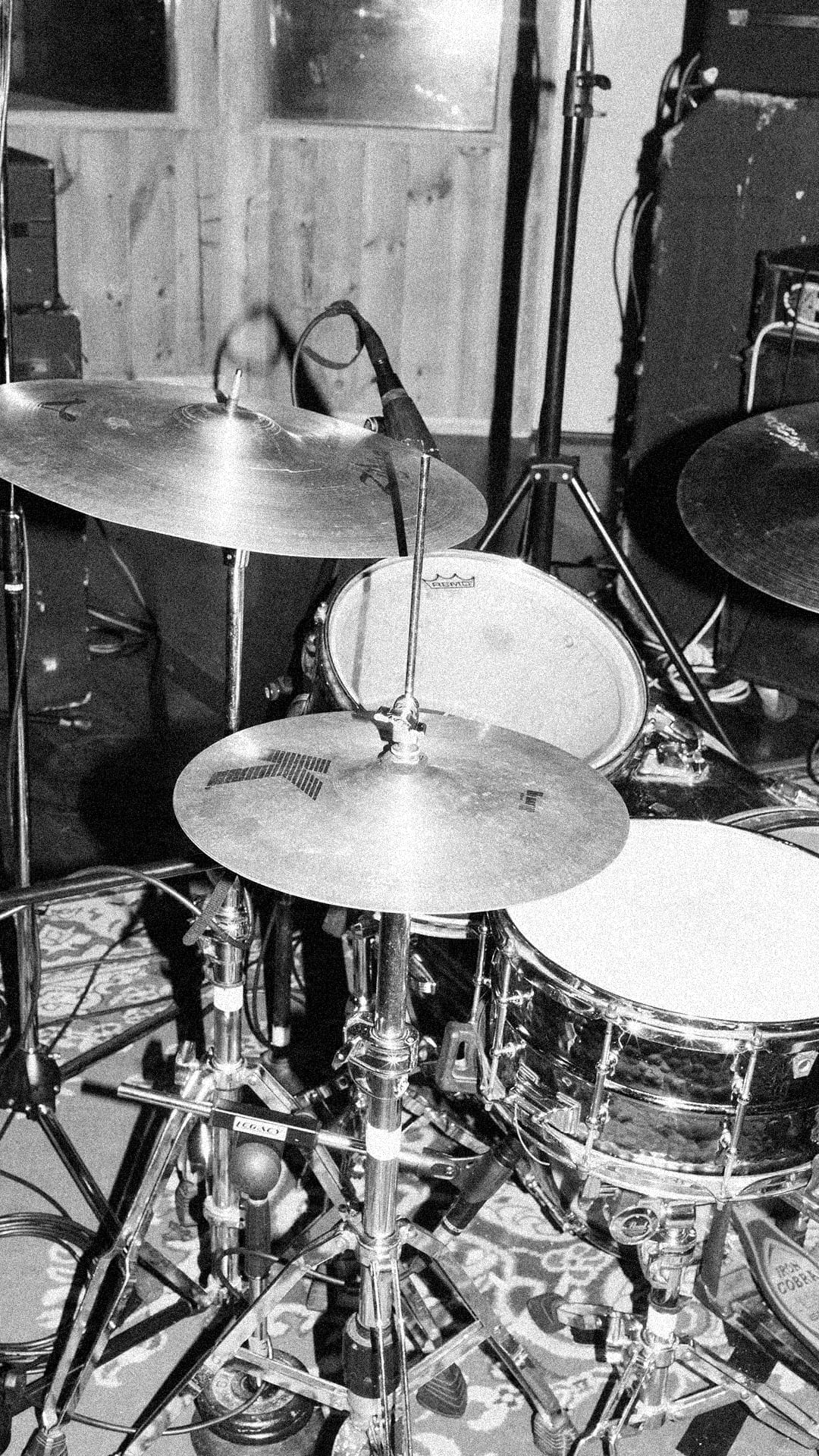 A drum kit with cymbals in the live room